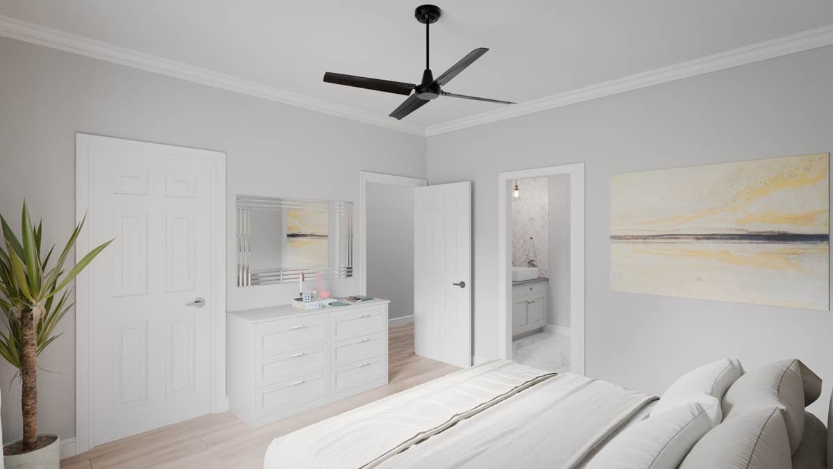 Bedroom with a dresser, mirror, painting, ceiling fan, and adjoining bathroom.