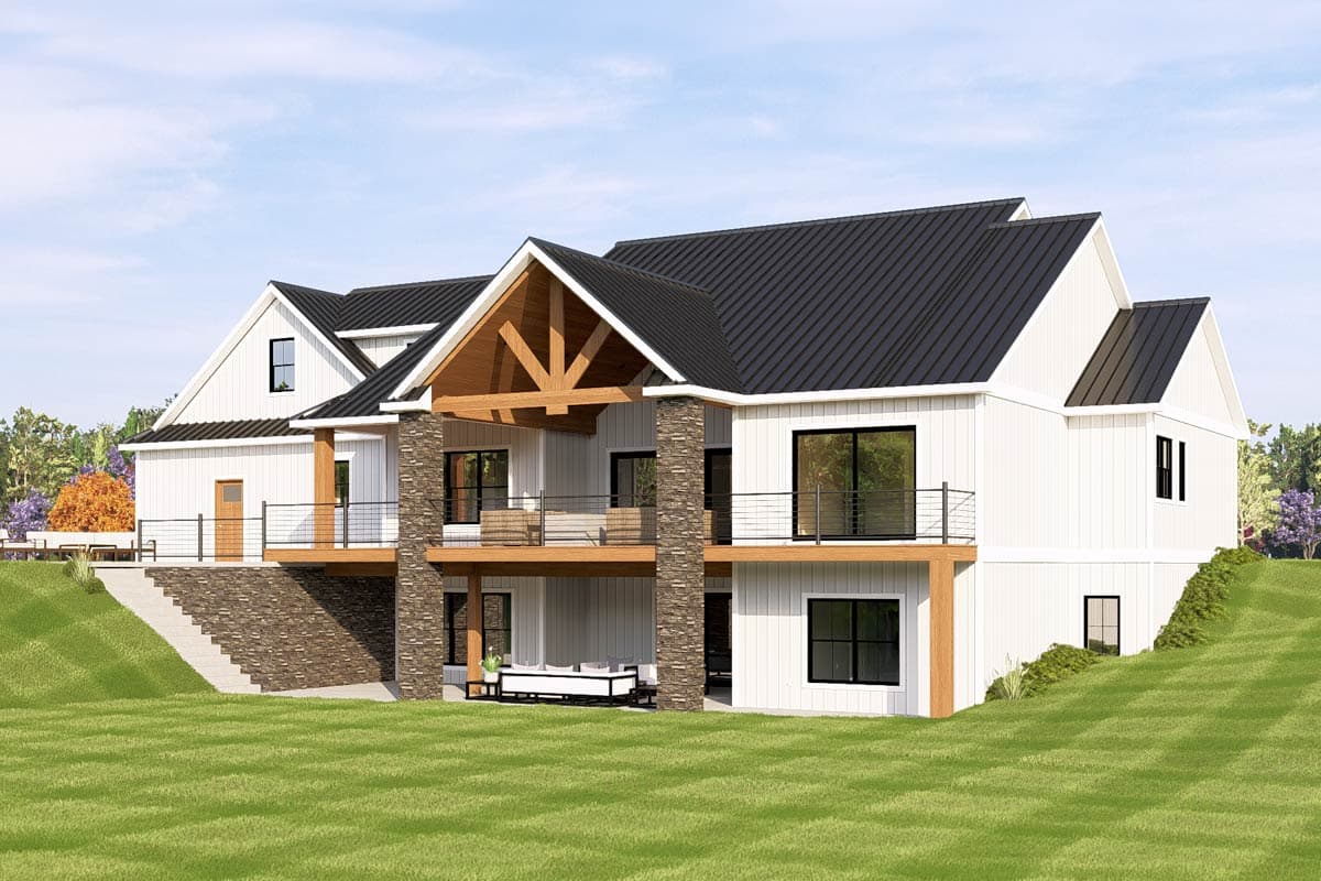 House plan exterior: Modern Farmhouse style with gabled dormers, covered balconies, and stone-clad columns.