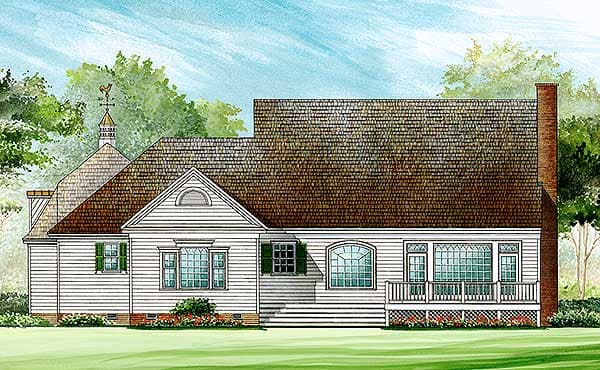 House plan exterior: Traditional style, one-story, with a gabled dormer, arched windows, and a covered porch with decorative lattice.
