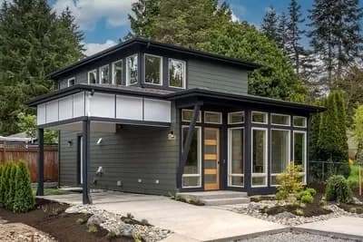 Modern Cottage Plan with Open Living Space and Single Carport