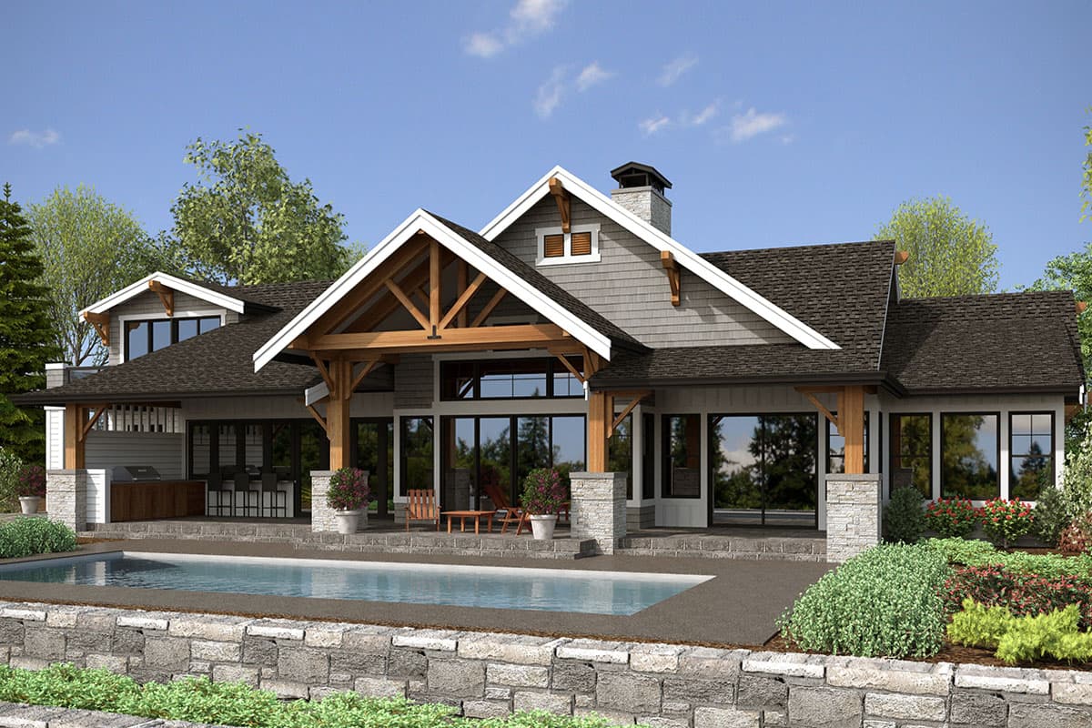 House plan exterior: Modern Craftsman style, two stories, with exposed timber beams, stone columns, and a covered patio with an outdoor kitchen.