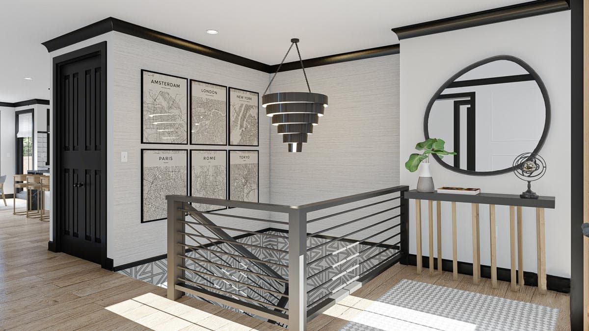 Interior hallway with modern metal railing, graphic maps, and layered chandelier.