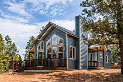 Exclusive Mountain Home Plan with Wraparound Deck and Vaulted Loft
