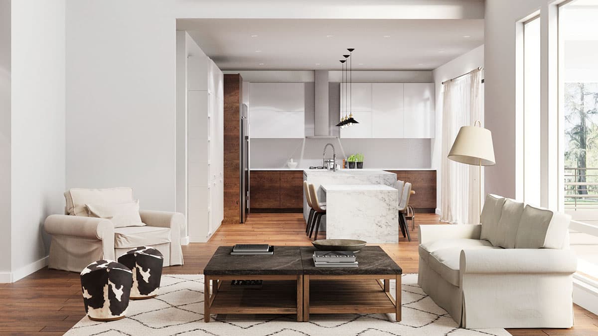 Open concept living area with seating, coffee table, and view to modern kitchen with island and pendant lighting.