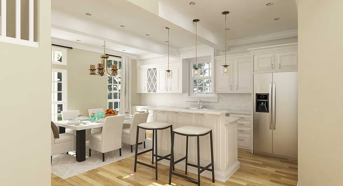 Open-concept kitchen with island, white cabinetry, and adjacent dining area featuring a chandelier.