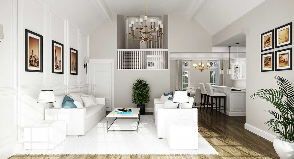 Great room with vaulted ceiling, two-story staircase, open to kitchen with island and bar seating.