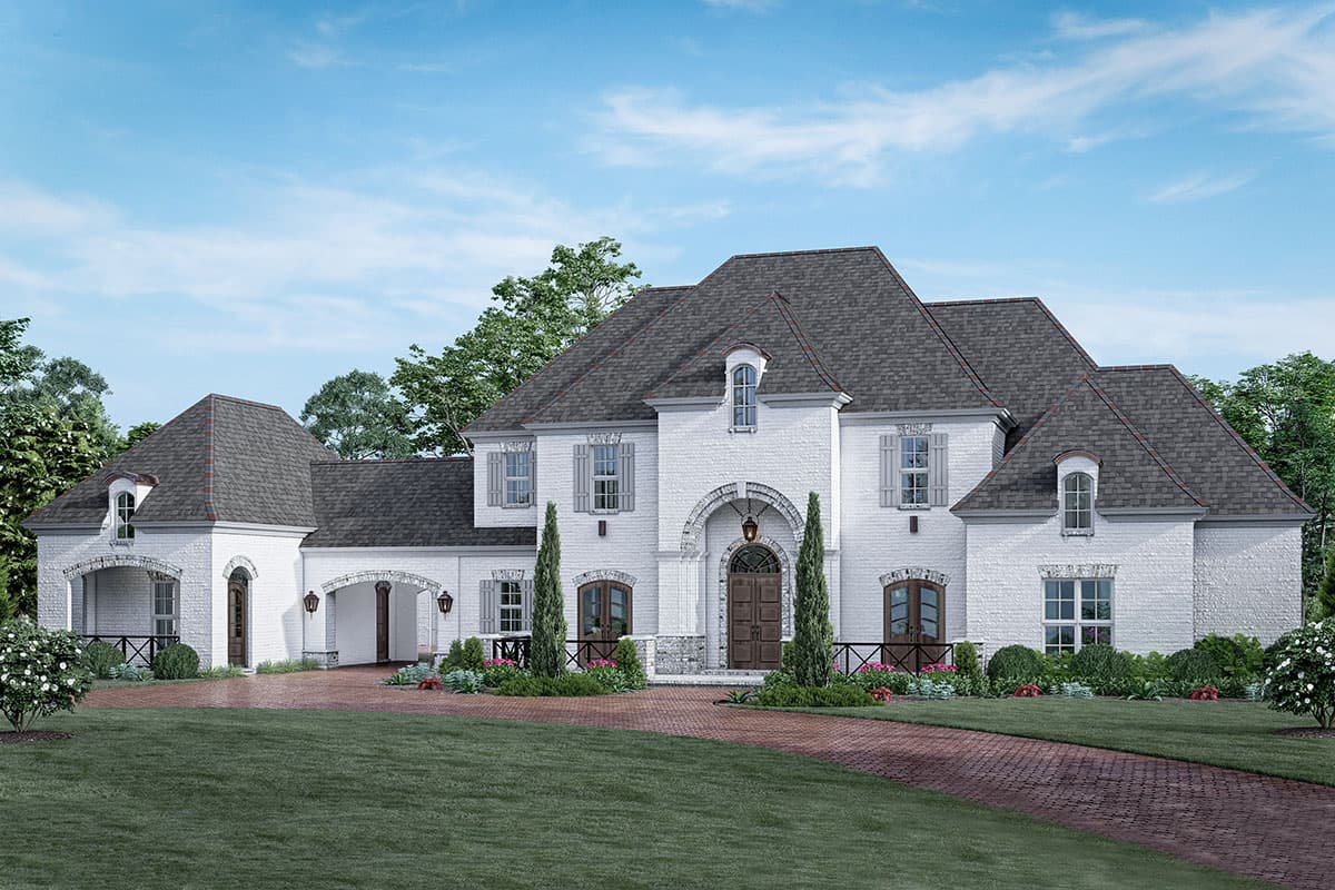 House plan exterior. Two-story French style home with brick facade, multiple gables, arched entry, and dormers. Features a brick paver driveway.