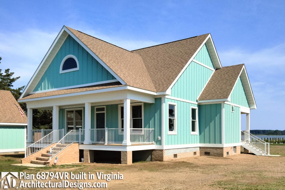 House plan exterior: Two-story Modern Farmhouse with gabled dormers, covered porch, and vertical siding.
