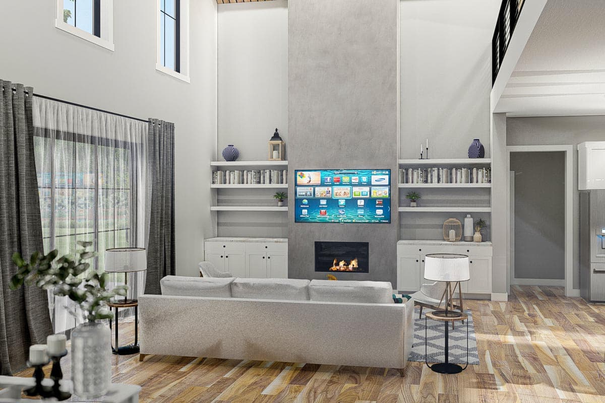 Great room with fireplace, built-in bookshelves, and tall ceilings. Includes a large window and smart TV.
