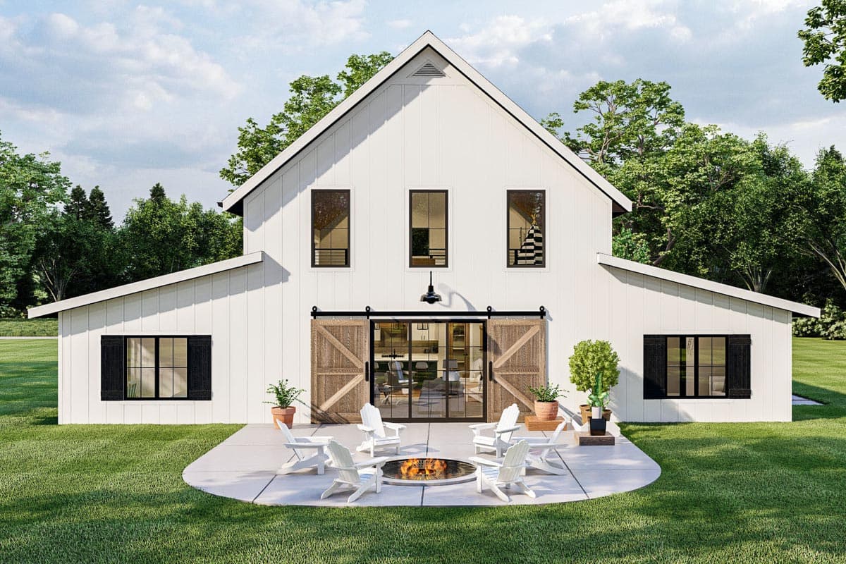 Modern farmhouse house plan exterior with central gables, multiple dormers, and large sliding barn doors.