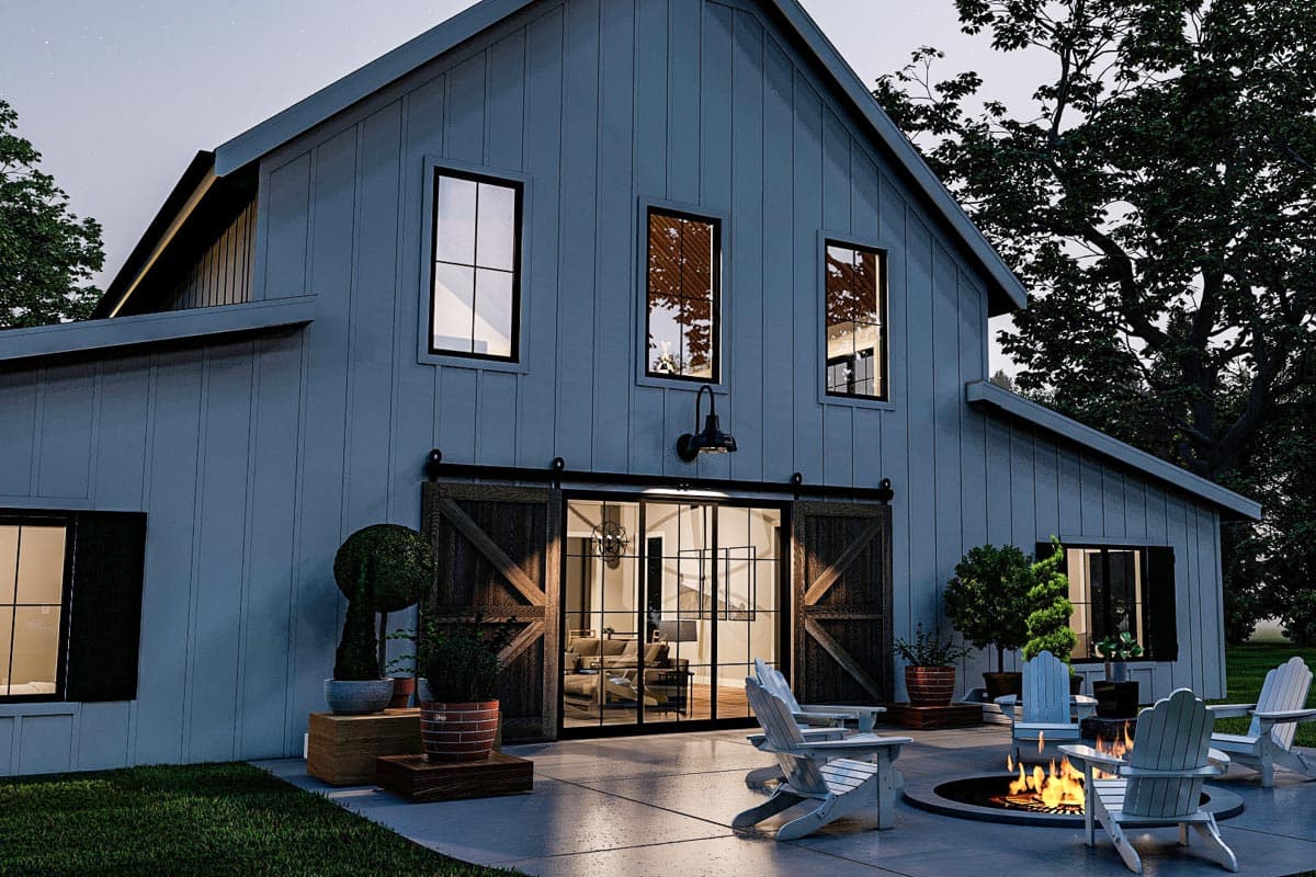 Modern farmhouse house plan exterior with vertical siding, gable roof, large sliding barn doors, and central glass entry.
