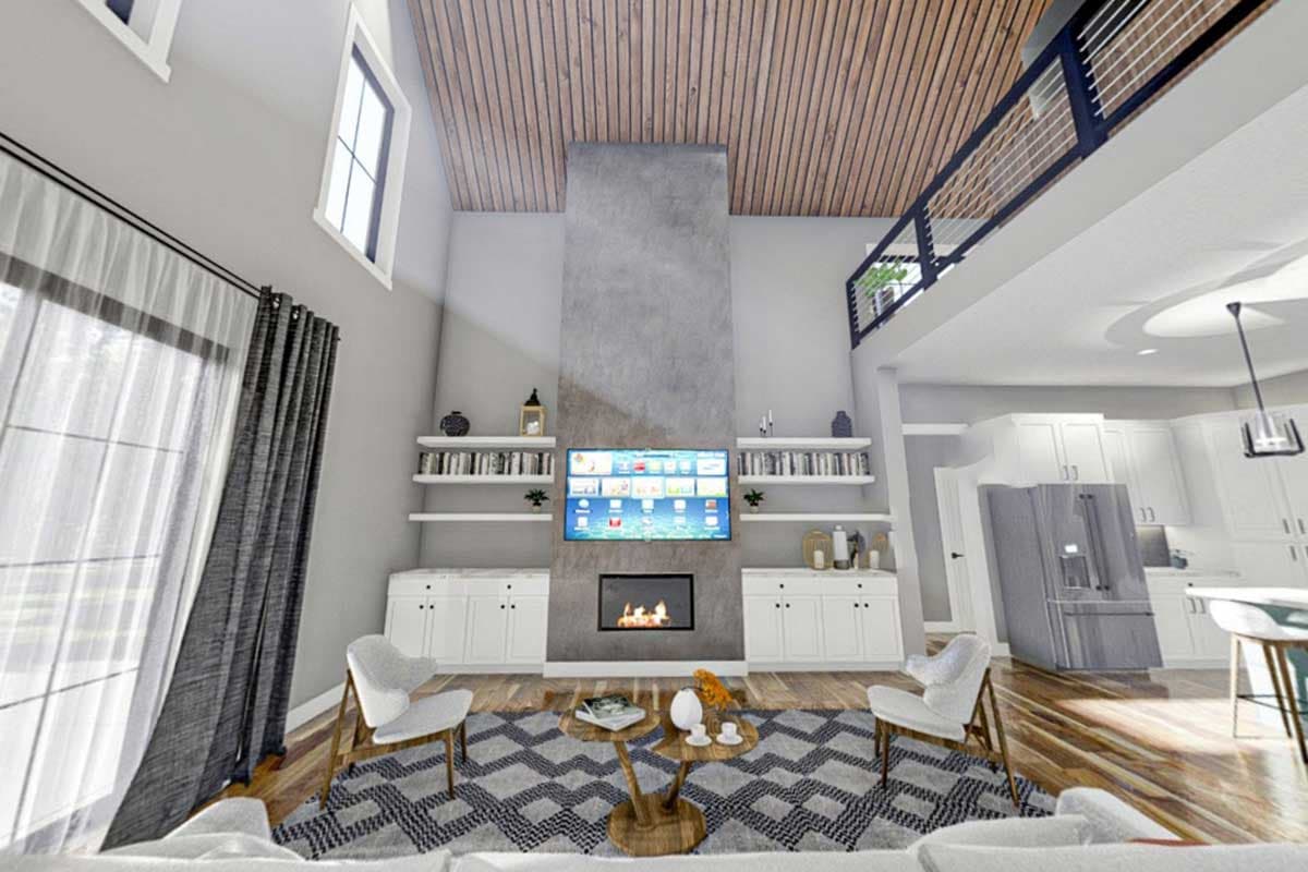 Great room with vaulted wood ceiling, concrete fireplace, shelving, and open-concept kitchen with island.