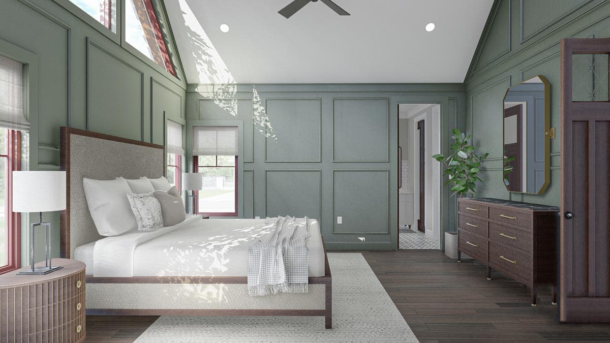 Primary bedroom with vaulted ceiling, paneled walls, large windows, and entryway to en suite.
