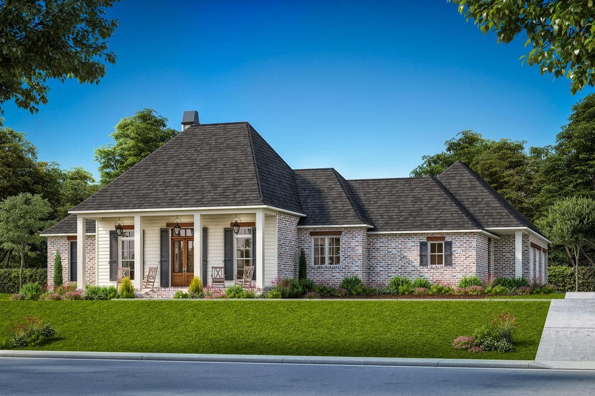 House plan exterior: One-story home with a deep front porch, white siding, brick accents, and a prominent central gable.