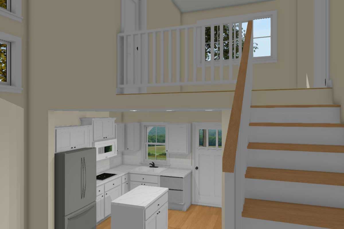 Interior view of a kitchen with white cabinetry, a stainless steel refrigerator, island, and stairs leading to a loft with a white railing.