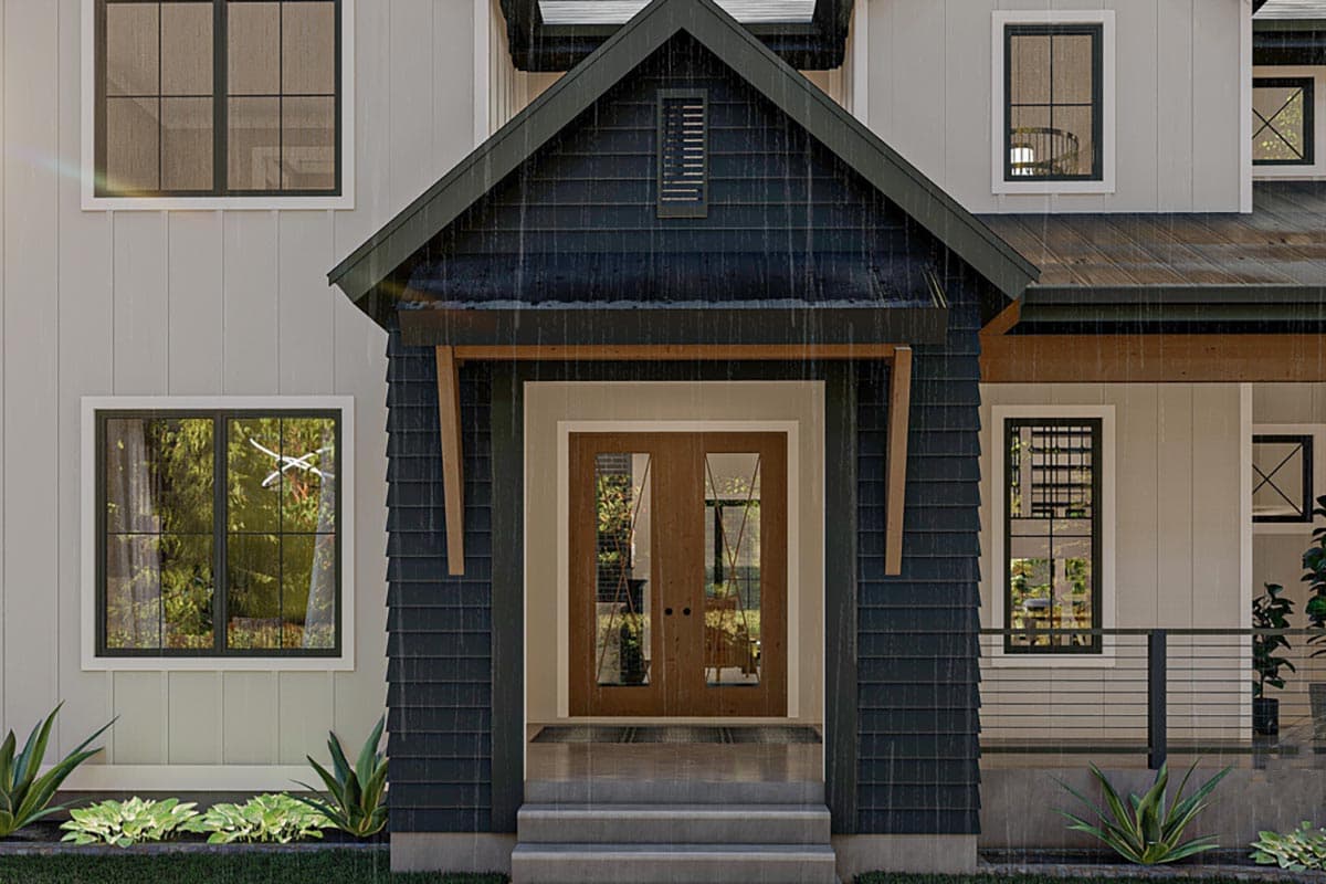 House plan exterior: Modern farmhouse style with a prominent gable entry, double front doors, and multi-pane windows.