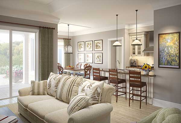 Open-concept living area with sofa, dining table, and kitchen island with pendant lights. Sliding glass doors open to outdoor space.