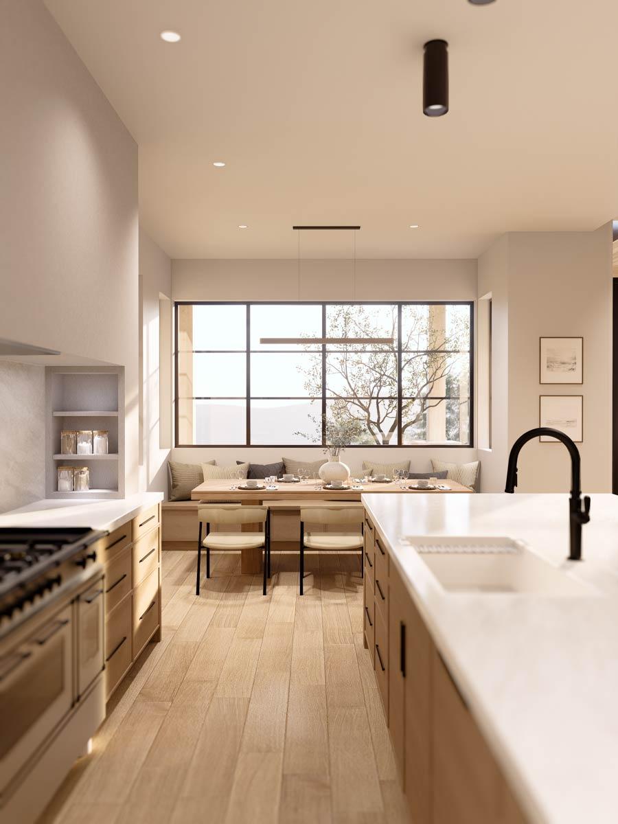 Kitchen and dining area with a large window, built-in banquette seating, and light wood flooring.