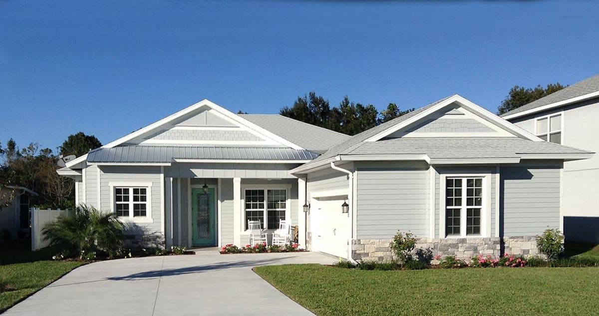 House plan exterior: one-story Modern Farmhouse with gabled dormers, metal roof accents, and attached garage.