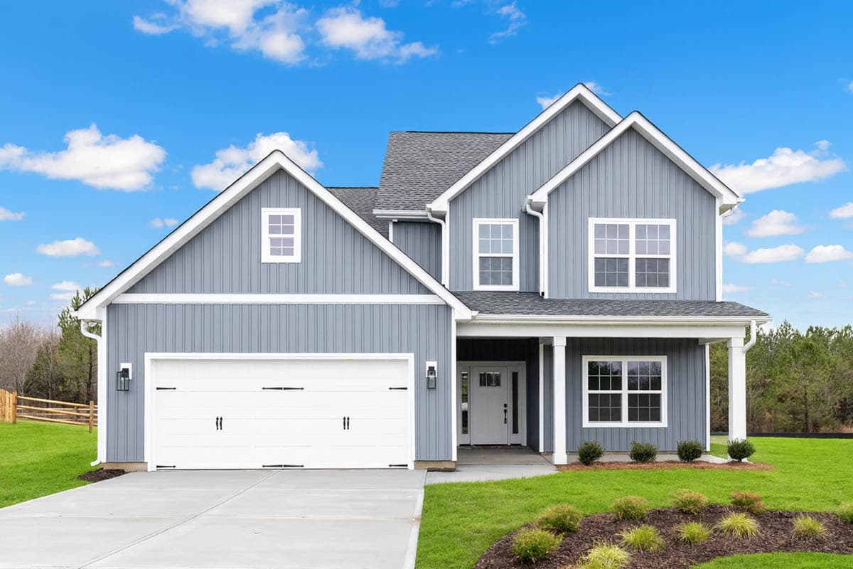 House plan exterior with two stories, board and batten siding, multiple gables, a front porch, and a two-car garage.