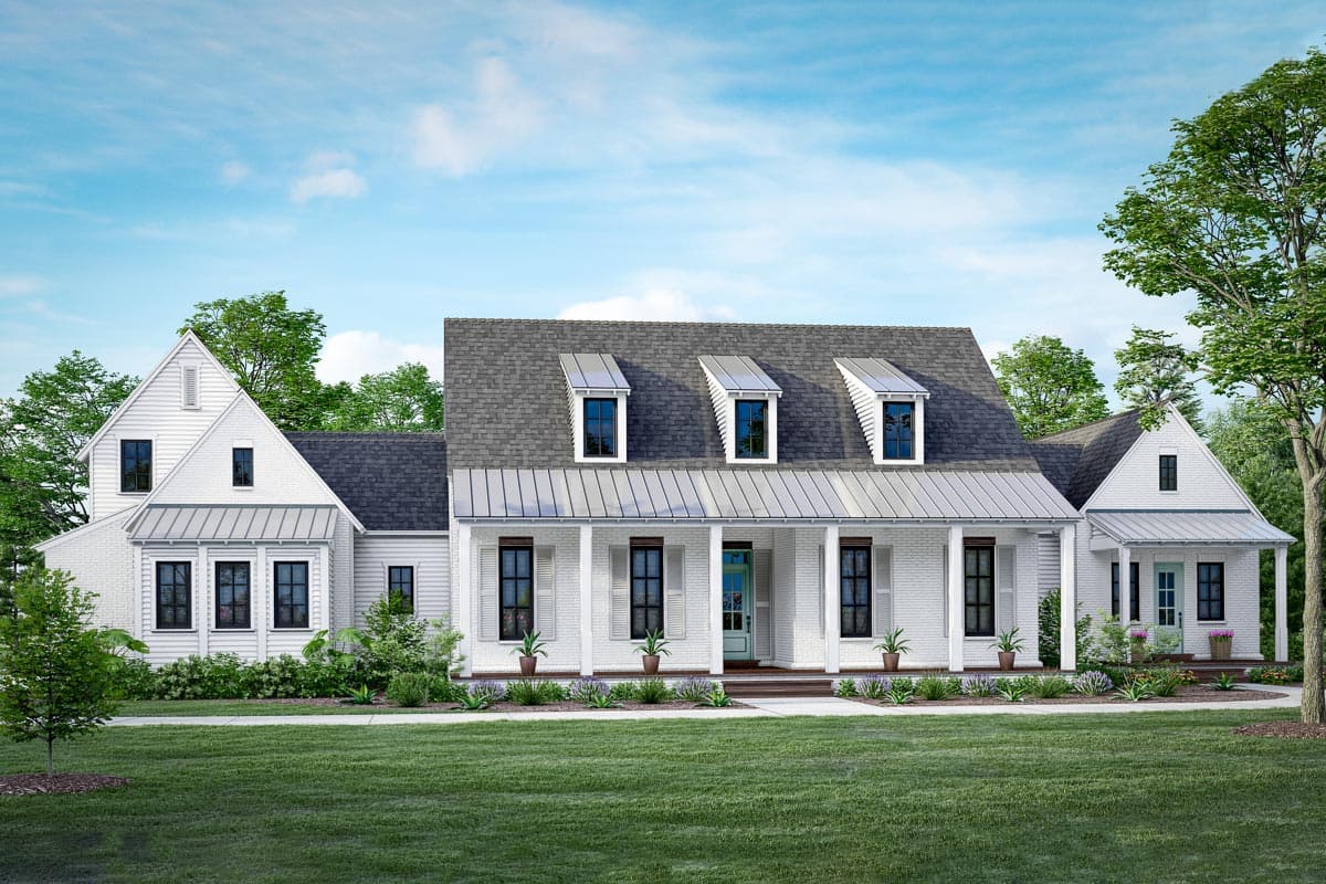 House plan exterior. White farmhouse style with dormers, front porch, and gable rooflines. Features brick facade and metal roof accents.