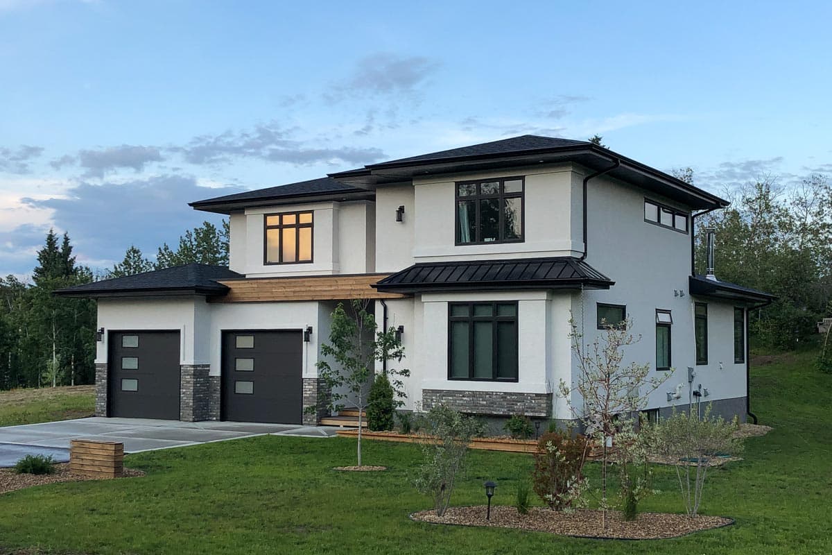 Modern two-story house plan exterior with triple garage, flat rooflines, and stucco finish.
