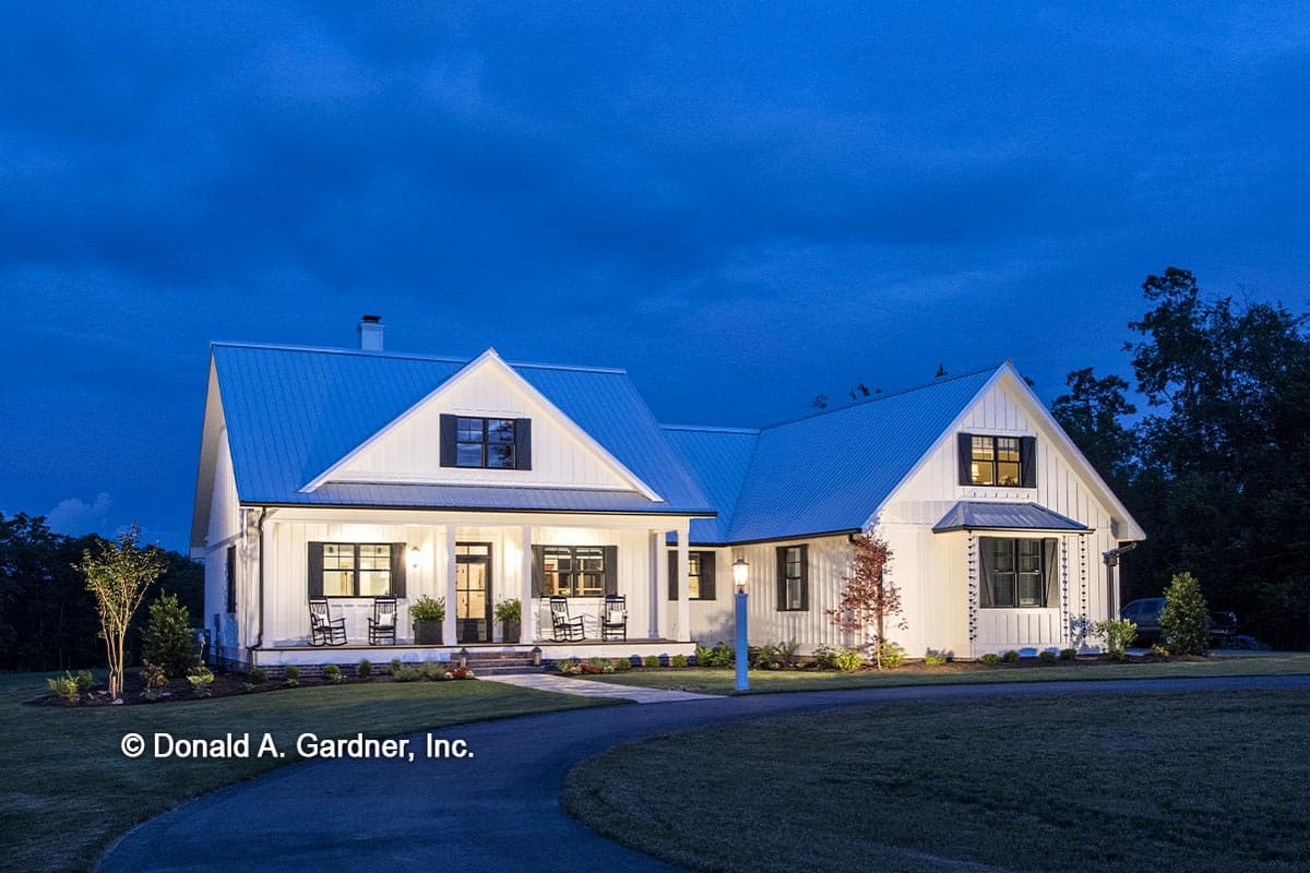 Modern Farmhouse house plan exterior with metal roof, prominent gable, and wraparound porch.