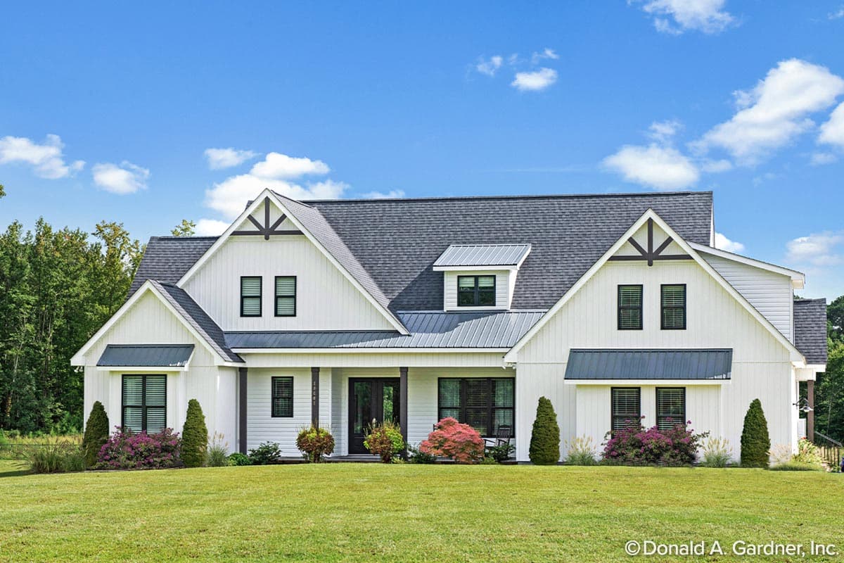 House plan exterior featuring a two-story Modern Farmhouse design. Notable features include a gabled roof, dormers, and a covered porch.