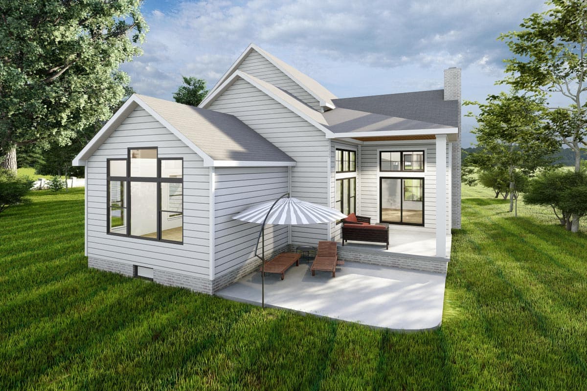 House plan exterior with intersecting gables, siding, large windows, and covered patio with outdoor furniture.