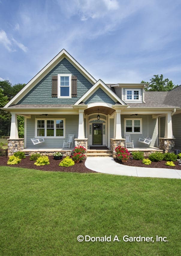 House plan exterior: Modern Farmhouse style, two stories, with a covered front porch, stone columns, and gabled dormers.