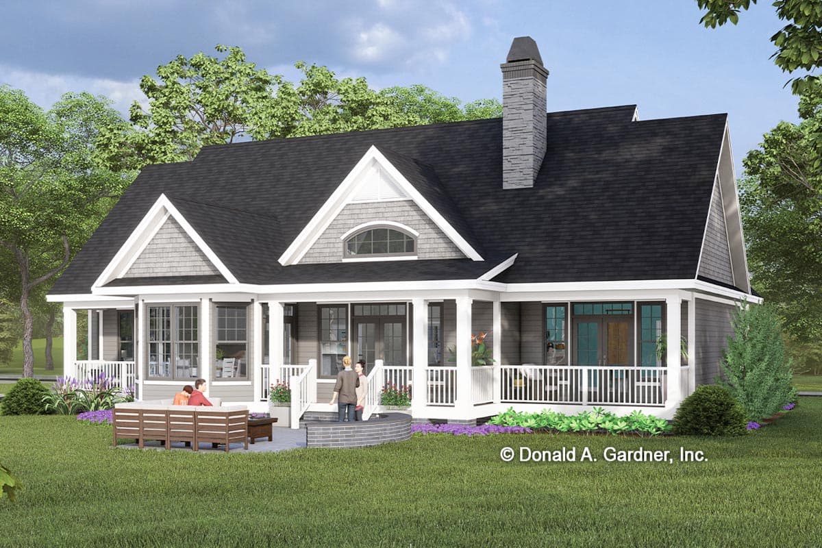 House plan exterior: A two-story Modern Farmhouse with a wrap-around porch, prominent gables, and stone chimney.