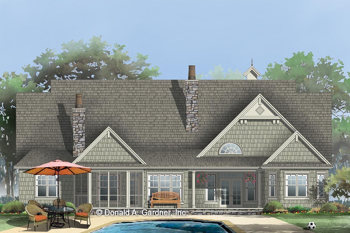 House plan exterior showing a one-story home with stone chimneys, gables, and a covered porch.