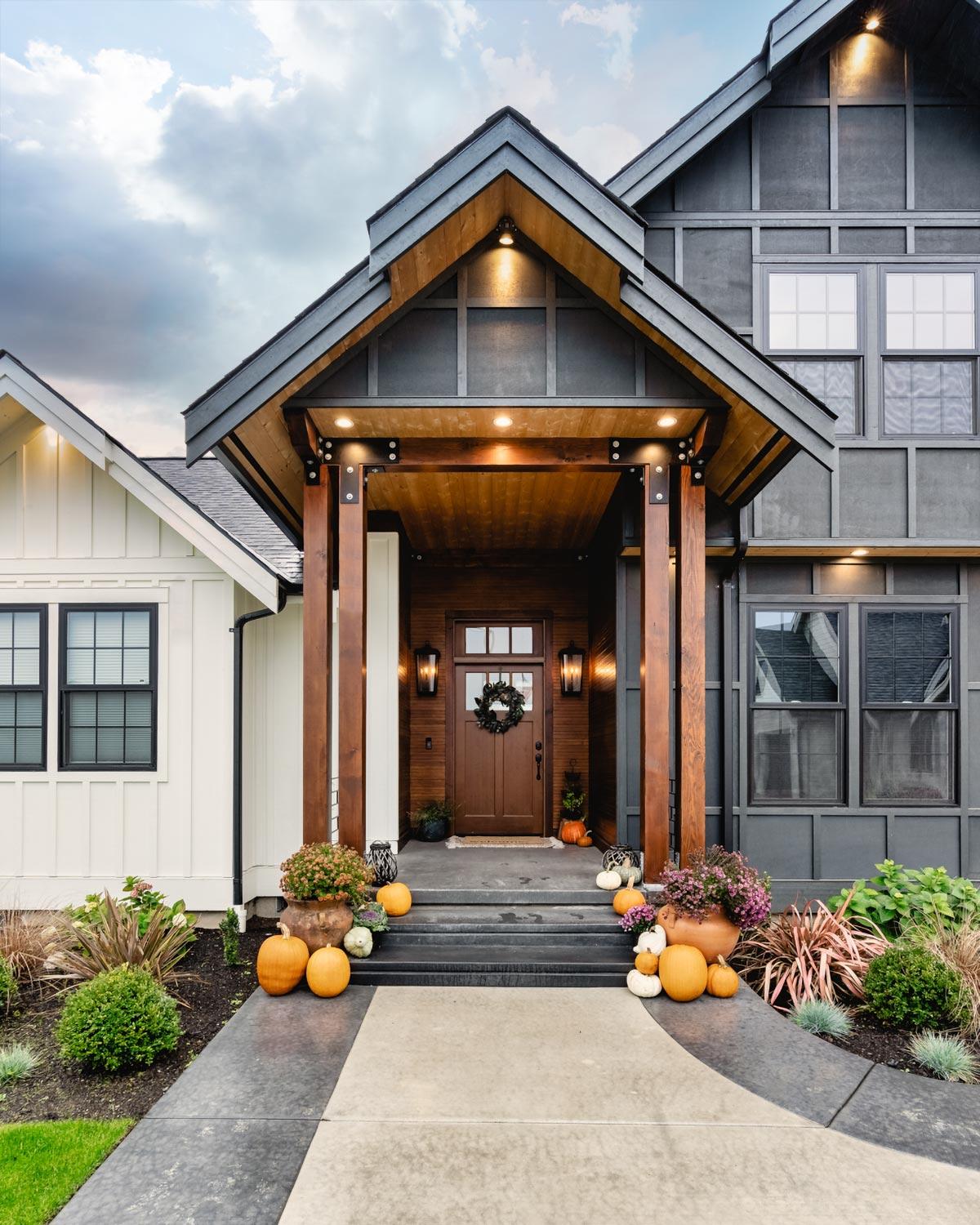 Modern Farmhouse house plan exterior with covered entry, wood beams, gabled rooflines, and board and batten siding.