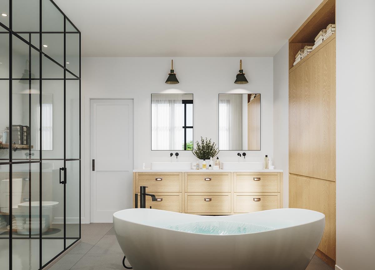 Modern bathroom with a freestanding bathtub filled with water. Features include wooden cabinets, glass shower, and wall-mounted sconces.