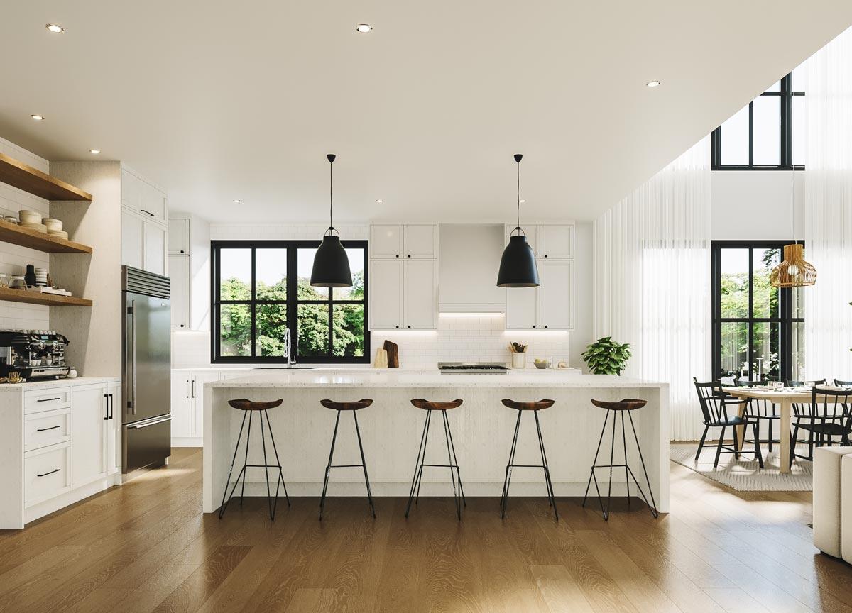 Modern, bright kitchen with a large island and bar stools, leading into a dining area with a round table and large windows.