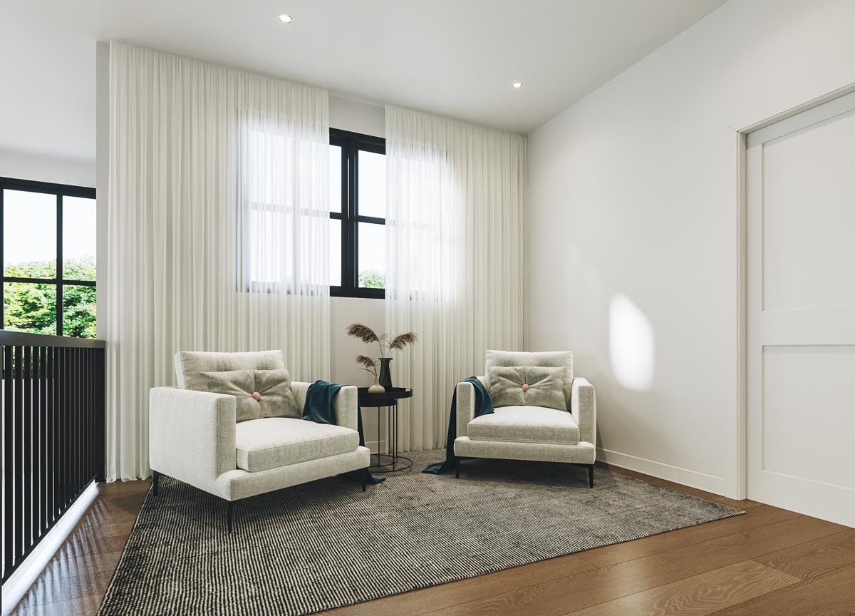 A modern living room features two armchairs, a small table with decor, and sheer white curtains. A large window provides natural light.