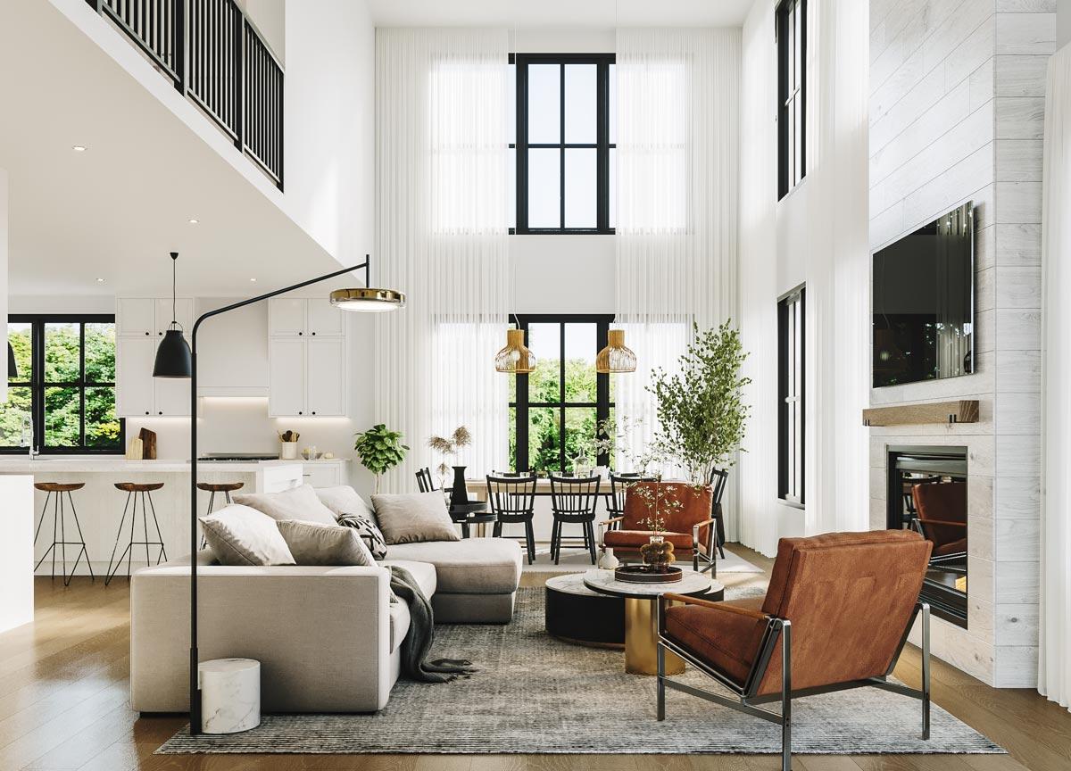 A modern, open-plan living room with high ceilings, a fireplace, and a large window overlooking a lush outdoor view. Furnishings are neutral-toned.