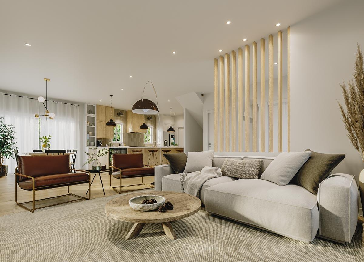 Open-concept living space with a sectional sofa, coffee table, and view into a kitchen with island and dining area.