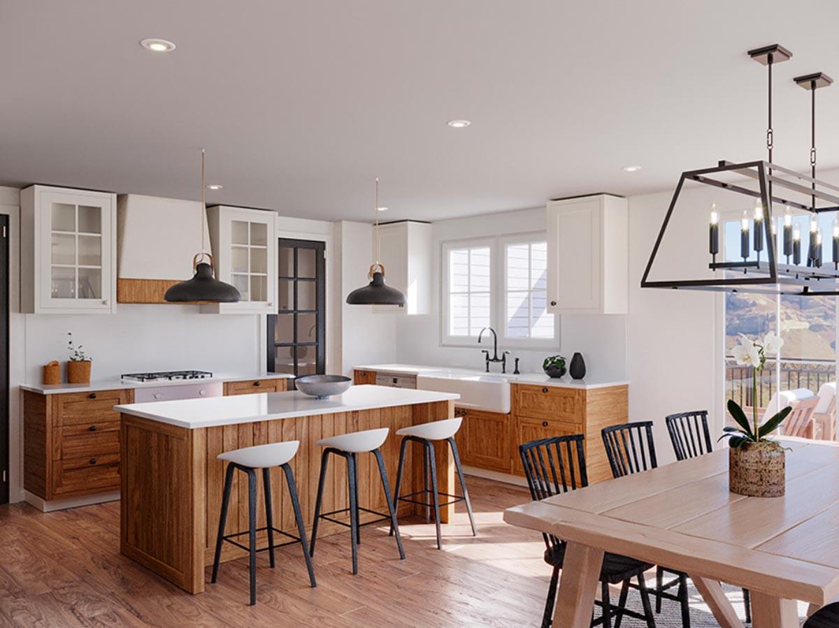 Modern farmhouse kitchen with large island, farmhouse sink, wood cabinetry, and dining area with chandelier.