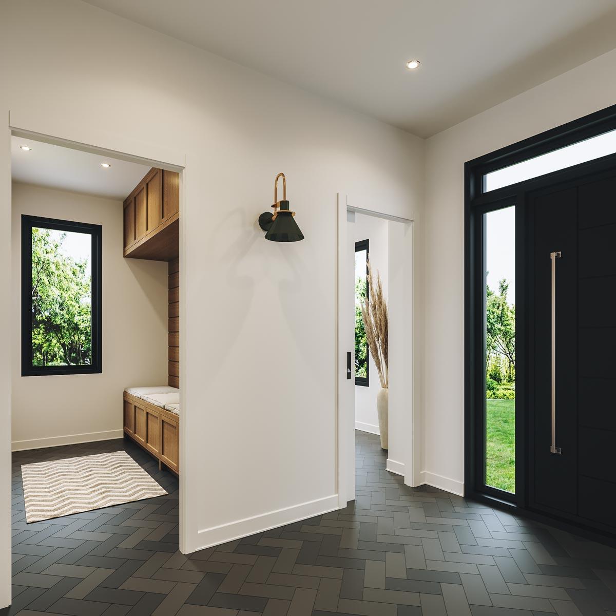 Entryway with modern black door, built-in wood bench, and herringbone tile floor.