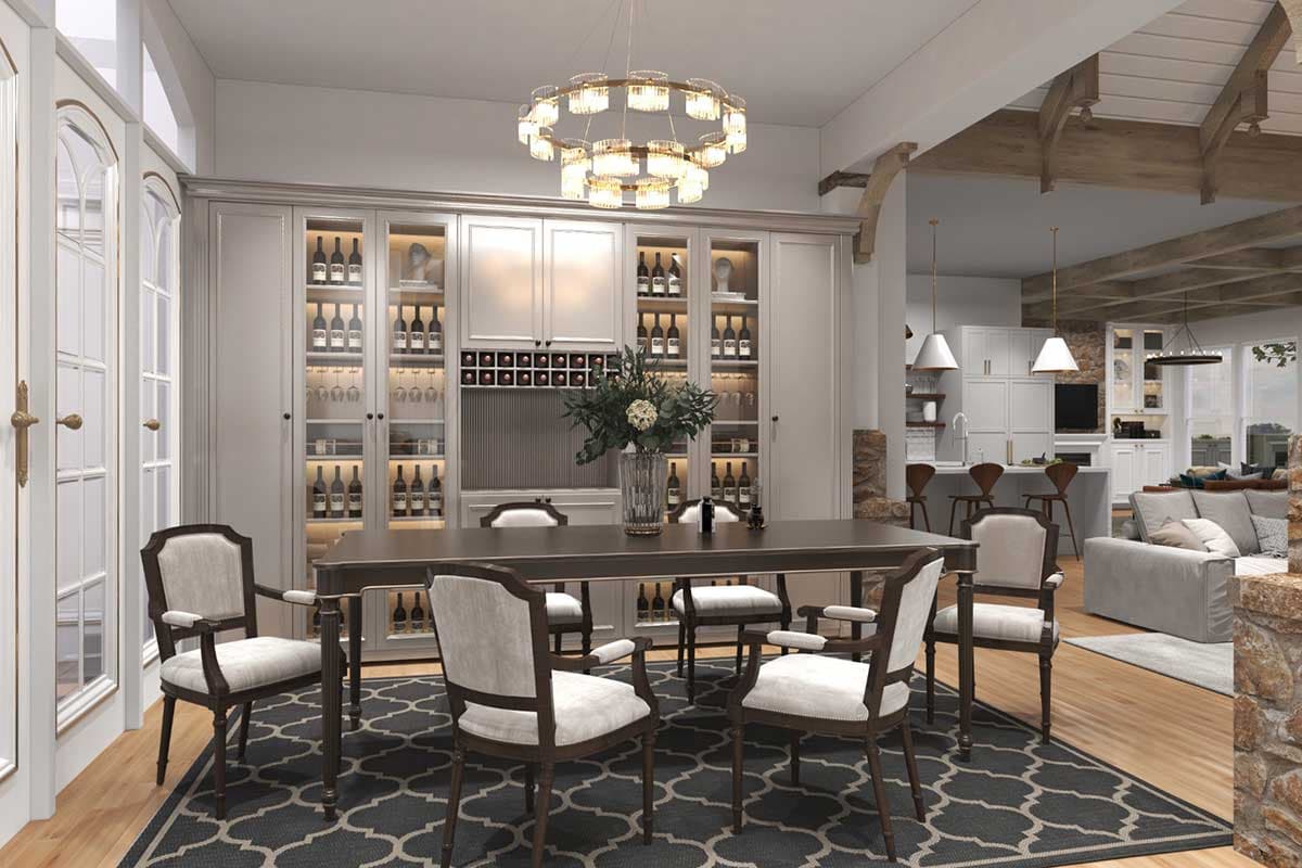 Dining room with a built-in wine cabinet, dark wood table and chairs, a circular chandelier, and an open view to the kitchen and living area.