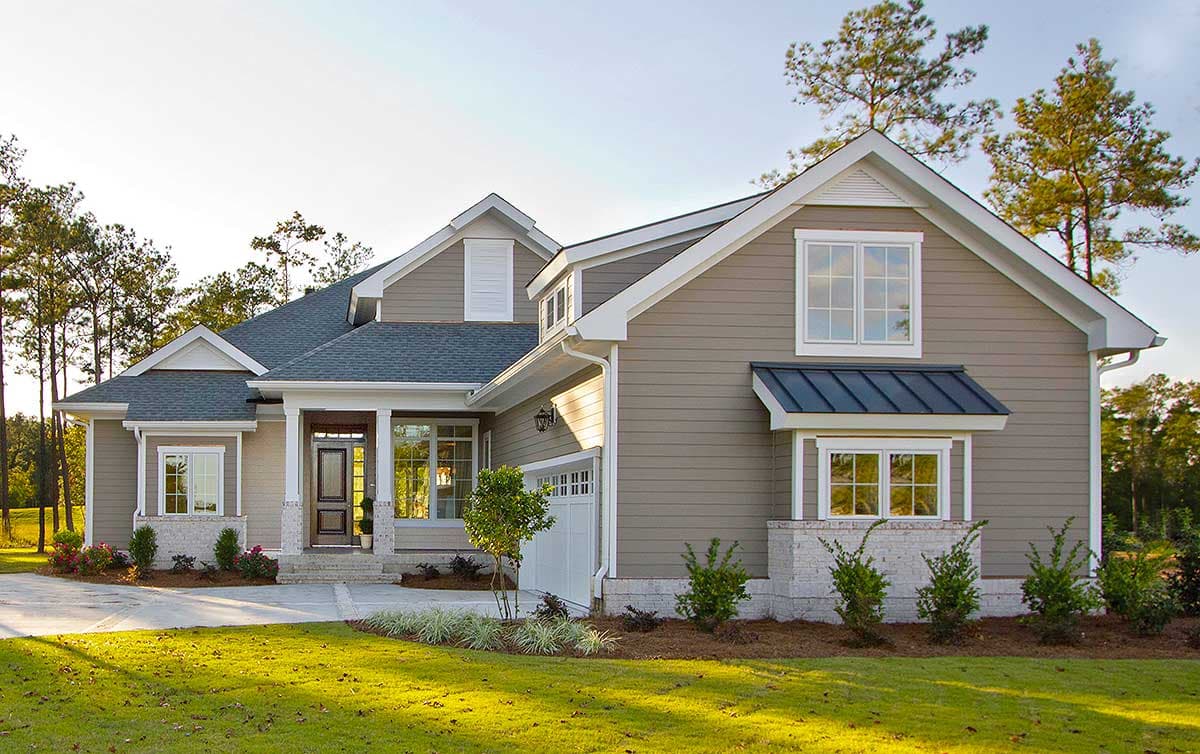 House plan exterior: Two-story modern farmhouse with gables, dormers, covered porch, and attached garage.