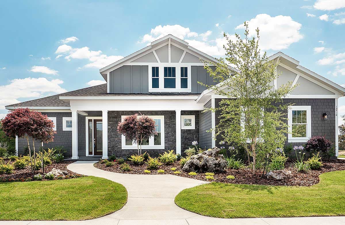 House plan exterior: Modern Farmhouse style, one-story with covered front porch, stone accents, and multiple gables.