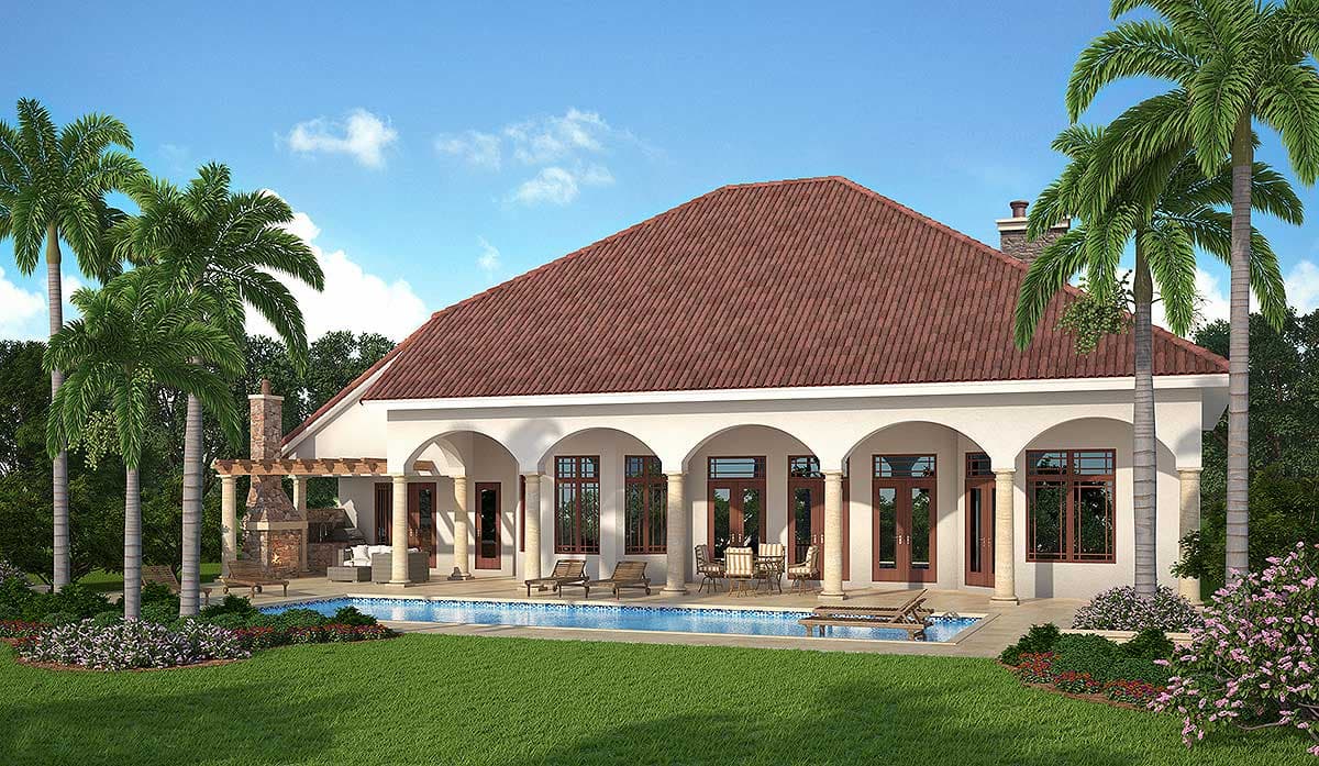 House plan exterior featuring a tiled roof, arched loggia with columns, and an outdoor fireplace.