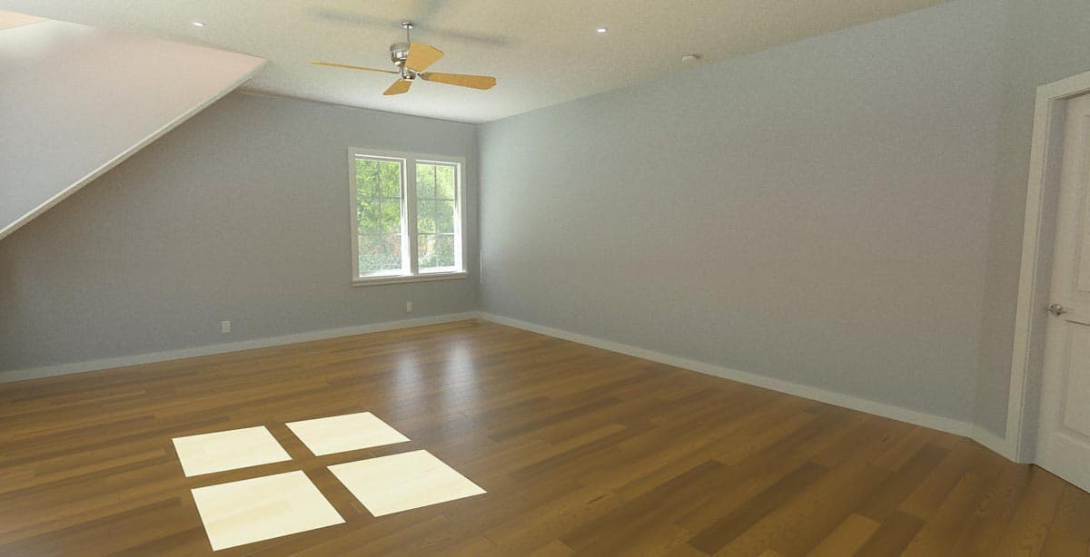 Interior view of an empty room with hardwood floors, a ceiling fan, and a large window with exterior greenery.