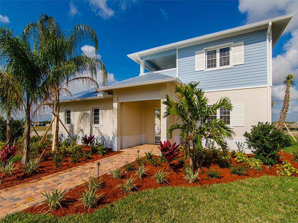 House plan exterior: Modern style, two stories, with a covered entry, upper balcony, and horizontal siding.
