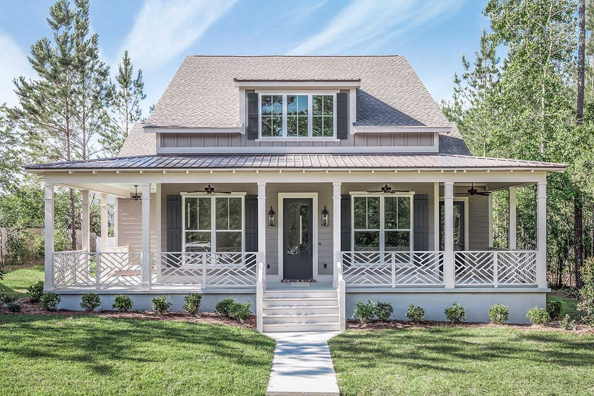 House plan exterior. Two-story home with Craftsman style. Features include a covered porch, dormer window, and gabled roofline.