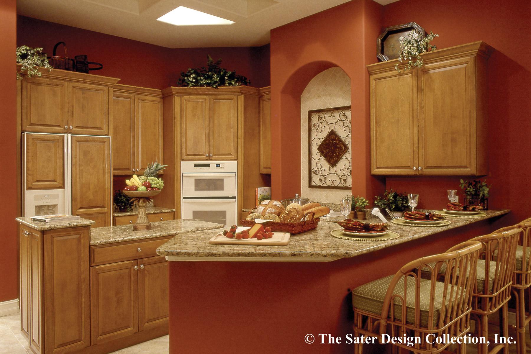 Kitchen with warm wood cabinetry, double ovens, and a granite countertop island with bar seating.