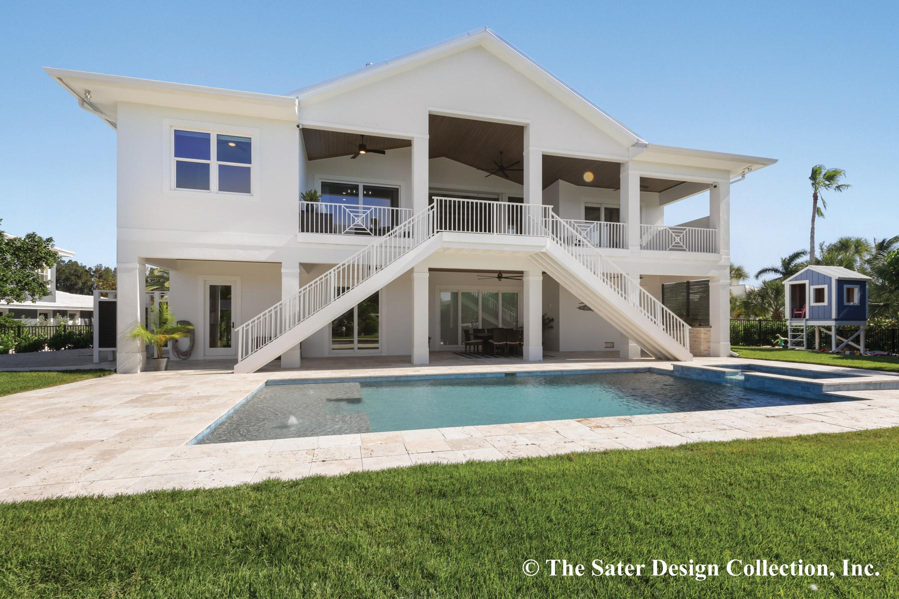 House plan exterior with raised foundation, double staircase, balconies, and pool.
