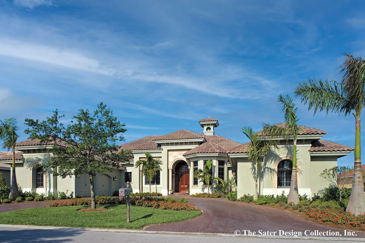 House plan exterior. One-story Mediterranean style with arched entryway, barrel tile roof, and a cupola. Includes attached garage.